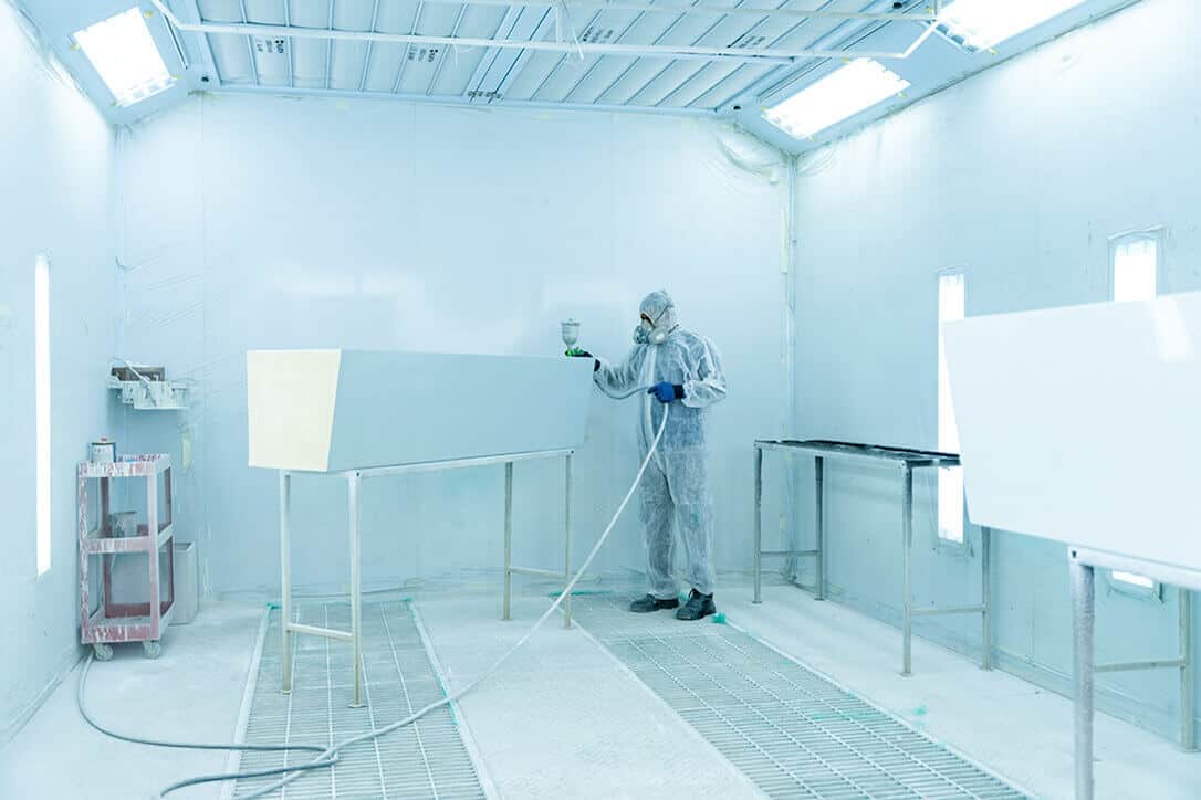 Paramed technician working on vehicle assembly.